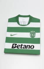 Sporting Lisbon 2025/26 home jersey with green and white horizontal stripes, Nike logo, and club cre.