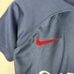 Official PSG kids 2023/24 home football jersey with Nike logo.