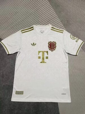 Authentic Bayern Munich anniversary football jersey with gold accents.
