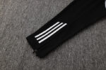 Adidas white tracksuit pants with black accents and three stripes, perfect for sports and casual wea.