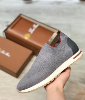 Casual grey slip-on shoes with red accents and comfortable sole. Perfect for everyday wear and sport.