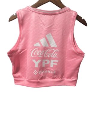 Pink women's crop top featuring Argentina team logo and sponsor branding, perfect for sports fans an.