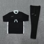 Nike Dri-Fit black tracksuit with white accents, ideal for sports and casual wear.
