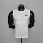 White Nike sleeveless athletic shirt with black logo, perfect for sports.