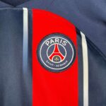 PSG kids home football kit 2023/24 with club logo and stylish design.