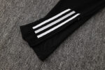 High-quality Adidas white tracksuit with black accents and three stripes. Perfect for sports and cas.