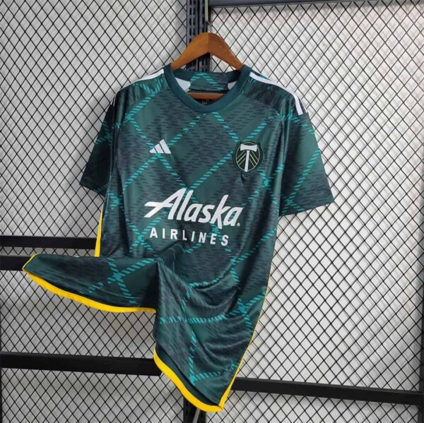 Portland Timbers 2023/24 home soccer jersey with team logo and Alaska Airlines sponsor.