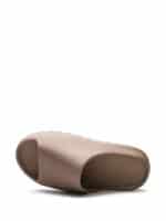 Comfortable beige slide sandal by Nike Off-White for men and women, perfect for casual wear.