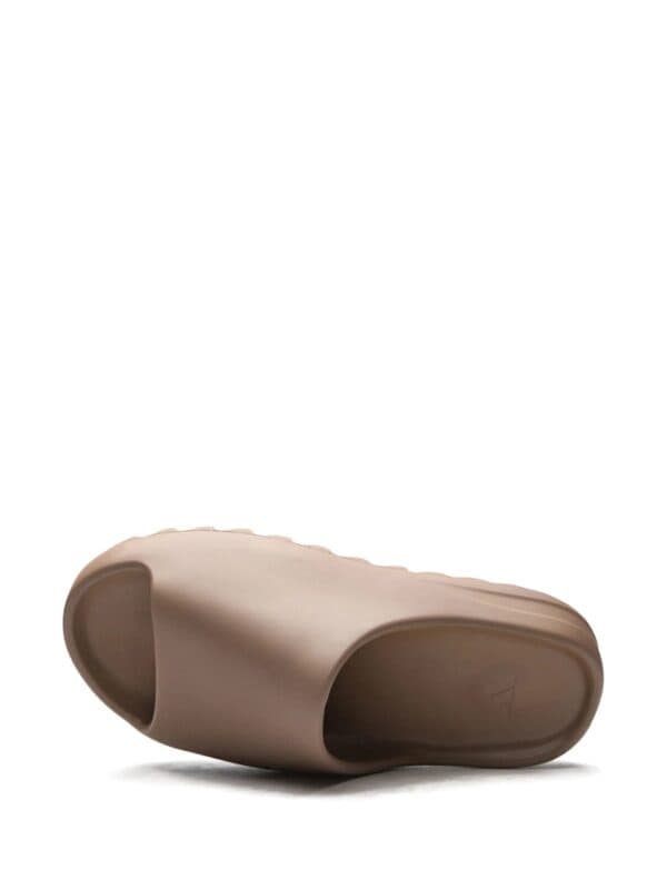 Comfortable beige slide sandal by Nike Off-White for men and women, perfect for casual wear.