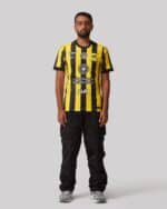 Authentic Al-Ittihad football jersey for 2025/26 season, featuring yellow and black stripes.