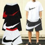 Comfortable Nike sports shorts in black, white, and red with iconic swoosh logo. Perfect for active.