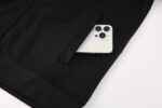 High-quality Nike Dri-fit jacket in black and white for athletes and sports enthusiasts.