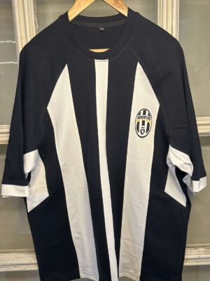 Juventus special edition football jersey with black and white vertical stripes.