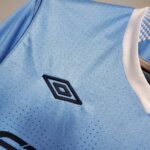 Manchester City limited edition football jersey with Umbro logo and Kun Agüero 2011-2012 design.