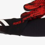 Adidas Predator Pro soccer gloves with red and black design, ideal for goalkeepers.