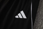 Adidas white tracksuit top with logo, perfect for sports and casual wear.