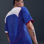 High-quality men's Nike Total 90 soccer jersey in blue with red accents. Perfect for football fans a.