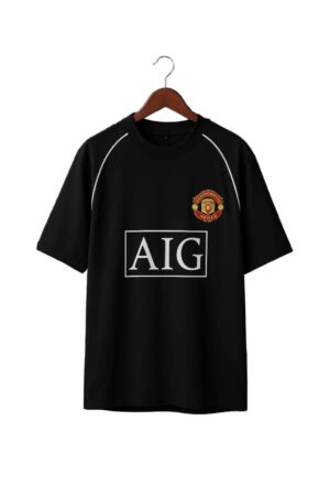 Black Manchester United football jersey with club crest and AIG sponsor logo.