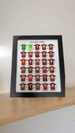 Football jersey display case with AC Milan team jerseys and logo.
