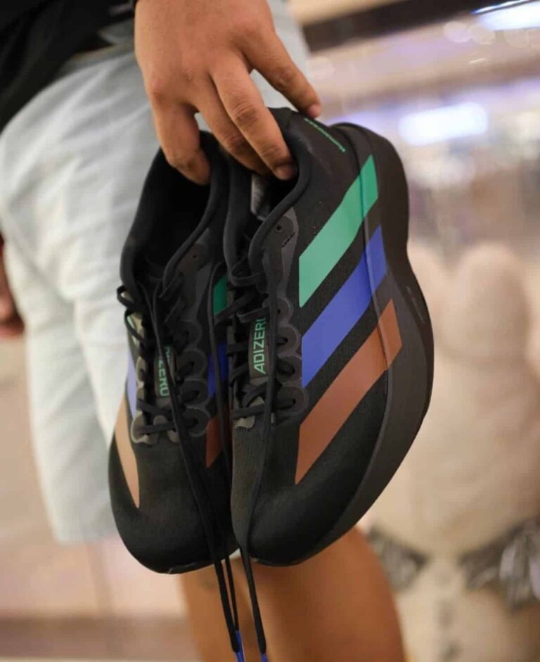 Adidas Adizero Evo SL Pharrell Humanrace black green blue sneakers for running and casual wear.