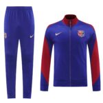 Barcelona FC official blue jacket and pants, perfect for fans and athletes, featuring team crest and.