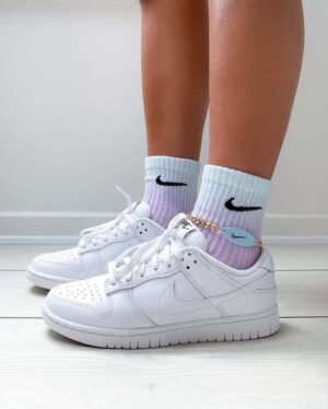 Nike Dunk Low Triple White sneakers for a clean, classic look. Perfect for casual and athletic wear.