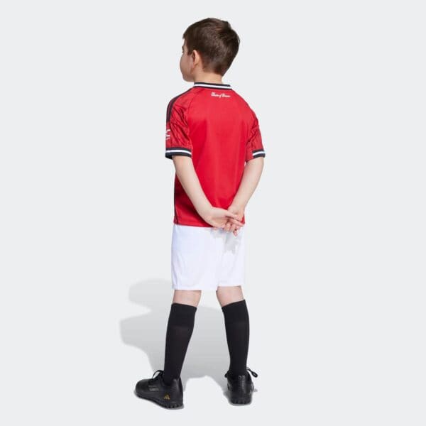Kids football kit featuring Manchester United design for 2025/26 season.