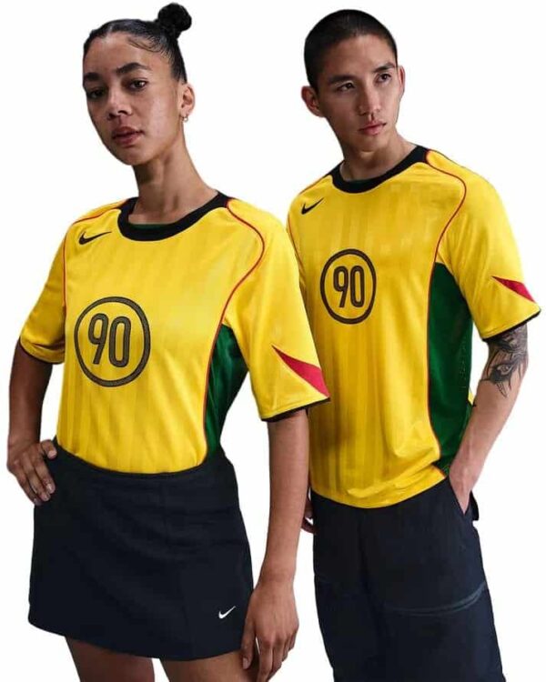 Nike Total 90 yellow soccer jersey for men with black and green accents.