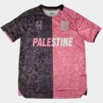 Palestine football jersey with floral design, pink and black split, featuring "PALESTINE" text and t.