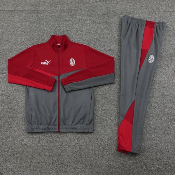 AC Milan pre-match tracksuit with red and gray design, featuring Puma logo and team crest.