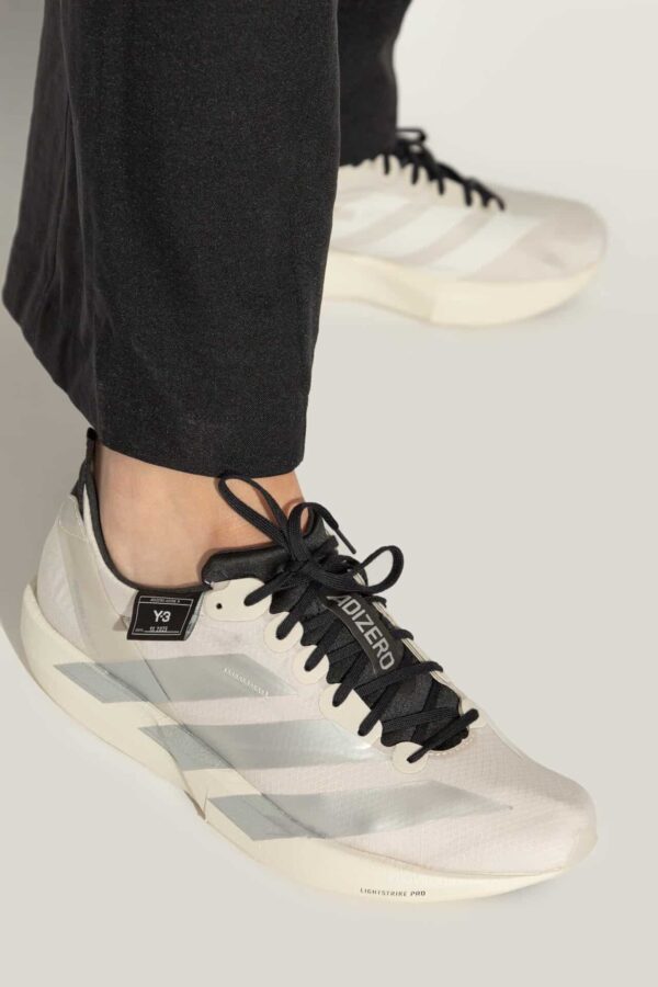 Adidas Y-3 cream training shoes with black accents, lightweight and comfortable for running and trai.