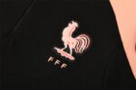 France black tracksuit with embroidered emblem and "FFF" logo. Perfect for football fans and sportsw.