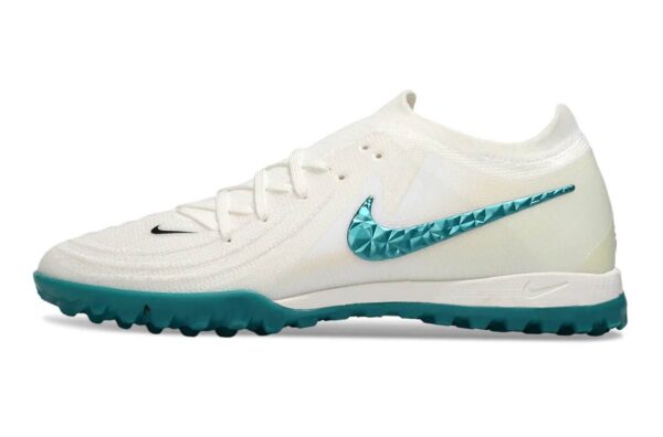 Nike Phantom GX II Elite Society white and green soccer cleats with blue Nike swoosh for optimal gri.
