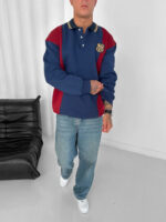 High-quality oversized football polo sweatshirt with bold color blocking and team crest.