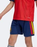 Spain Kids Home Kit 2026 - Authentic football jersey and shorts for young fans. Perfect for supporti.