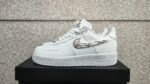 Air Force Low 1 ‘Molten Metal’ sneaker with metallic accents.
