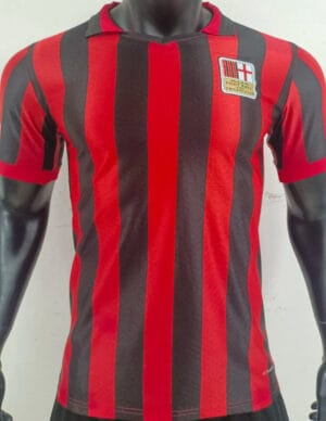 Authentic AC Milan red and black striped football jersey with club crest.