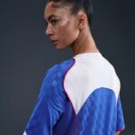 Women's Nike Total 90 soccer jersey in blue and white, lightweight and breathable sportswear.