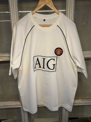 Authentic Manchester United white classic football jersey with club logo and sponsor.