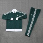 Authentic dark green Adidas football tracksuit with white stripes, perfect for training and casual w.
