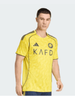 Nassr football jersey 2025/26, yellow home kit with team logo and Adidas branding.