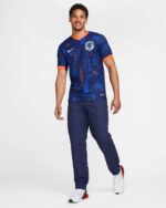Authentic Netherlands football away jersey 2024, blue with orange accents, official team crest, and.