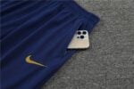 Portugal training suit with Nike logo and phone pocket.