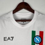 Official Napoli 2023/24 Scudetto champion football jersey with team crest and authentic design.