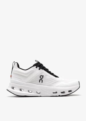 Athletic ON Cloudtilt trainers for women in white and black, perfect for running and casual wear.