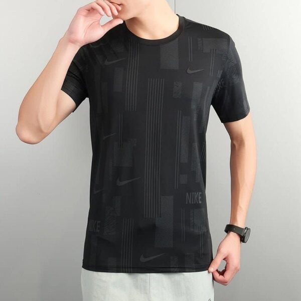 Black Nike men's athletic shirt with geometric pattern, short sleeves, and logo.