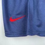 Close-up of PSG kids home kit with Nike logo for 2023/24 season.