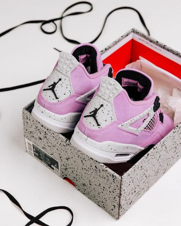 Air Jordan 4 Orchid sneakers in pink and black, new release from Jordan brand.