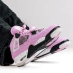 Air Jordan 4 Orchid - Authentic pink and black basketball shoes for sports and casual wear.