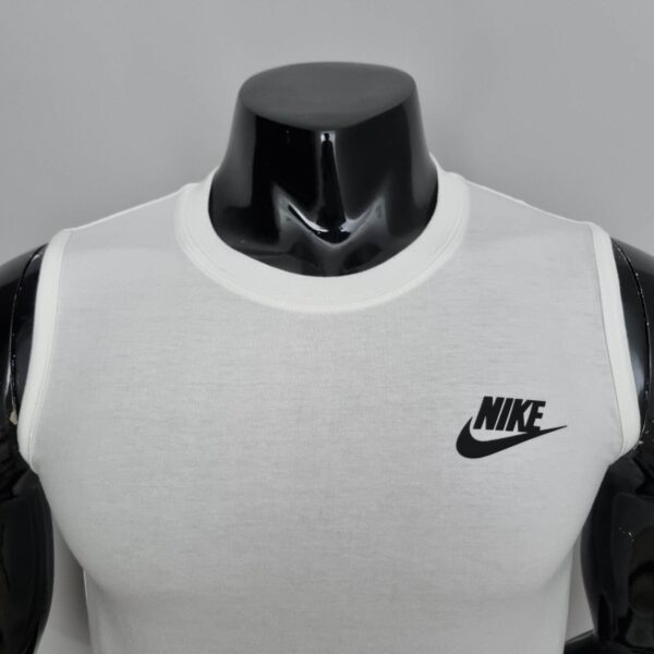 White Nike sleeveless athletic shirt with black logo, perfect for sports and casual wear.